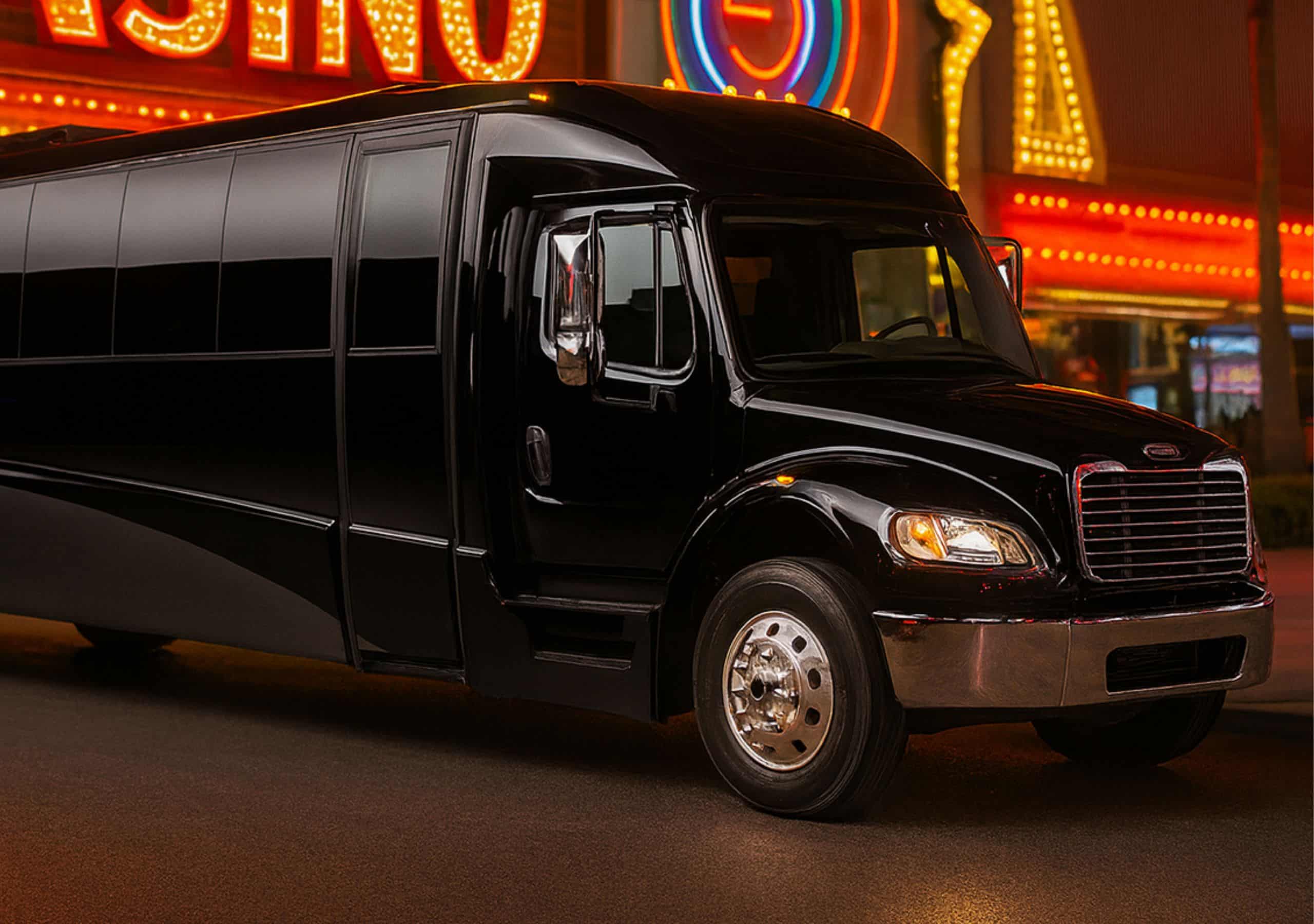 Champagne Room on Wheels 20-passenger Las Vegas party bus under glowing casino lights—great for nightlife and group events.