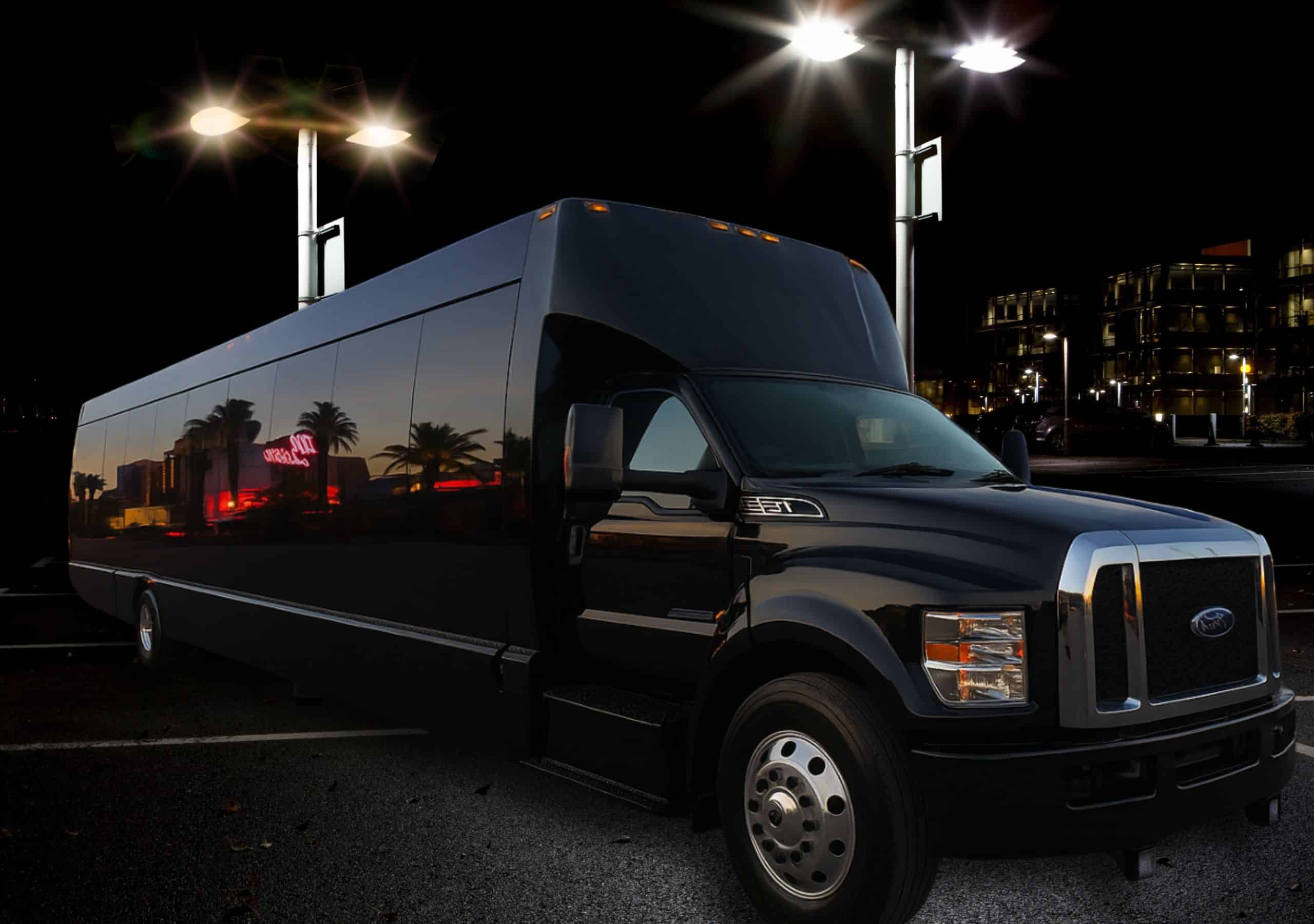 45-passenger Las Vegas party bus parked under bright streetlights — perfect for large groups and nightlife events.