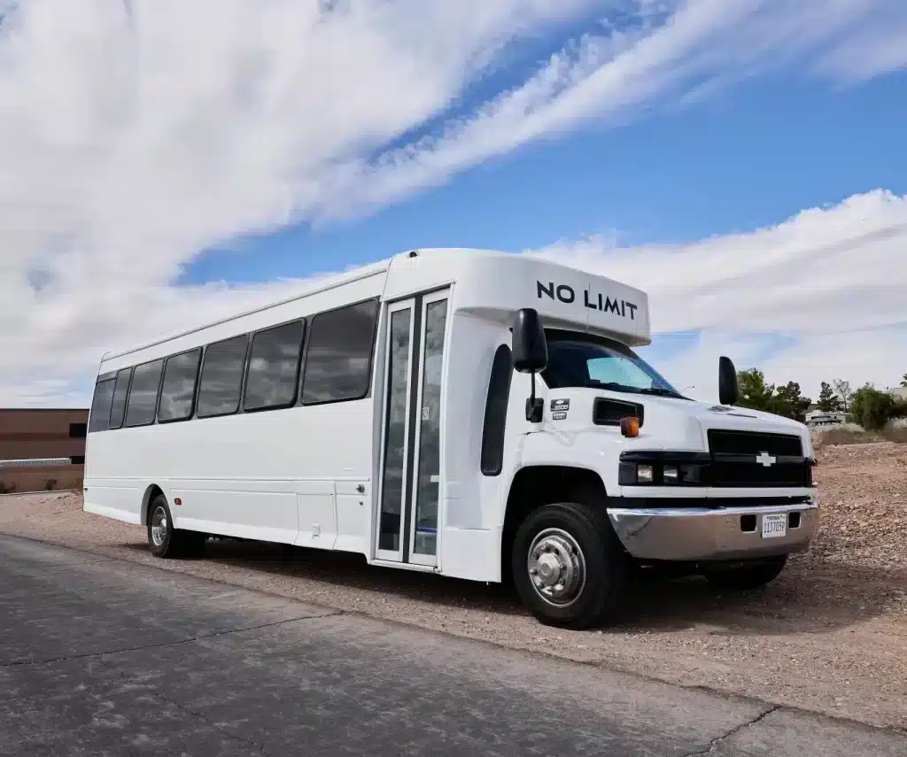 No Limit 32-passenger Las Vegas party bus with chrome grille and tinted windshield — great for group events and Strip trips.